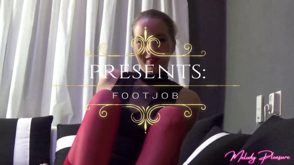 Wank his cock with my feet and stockings